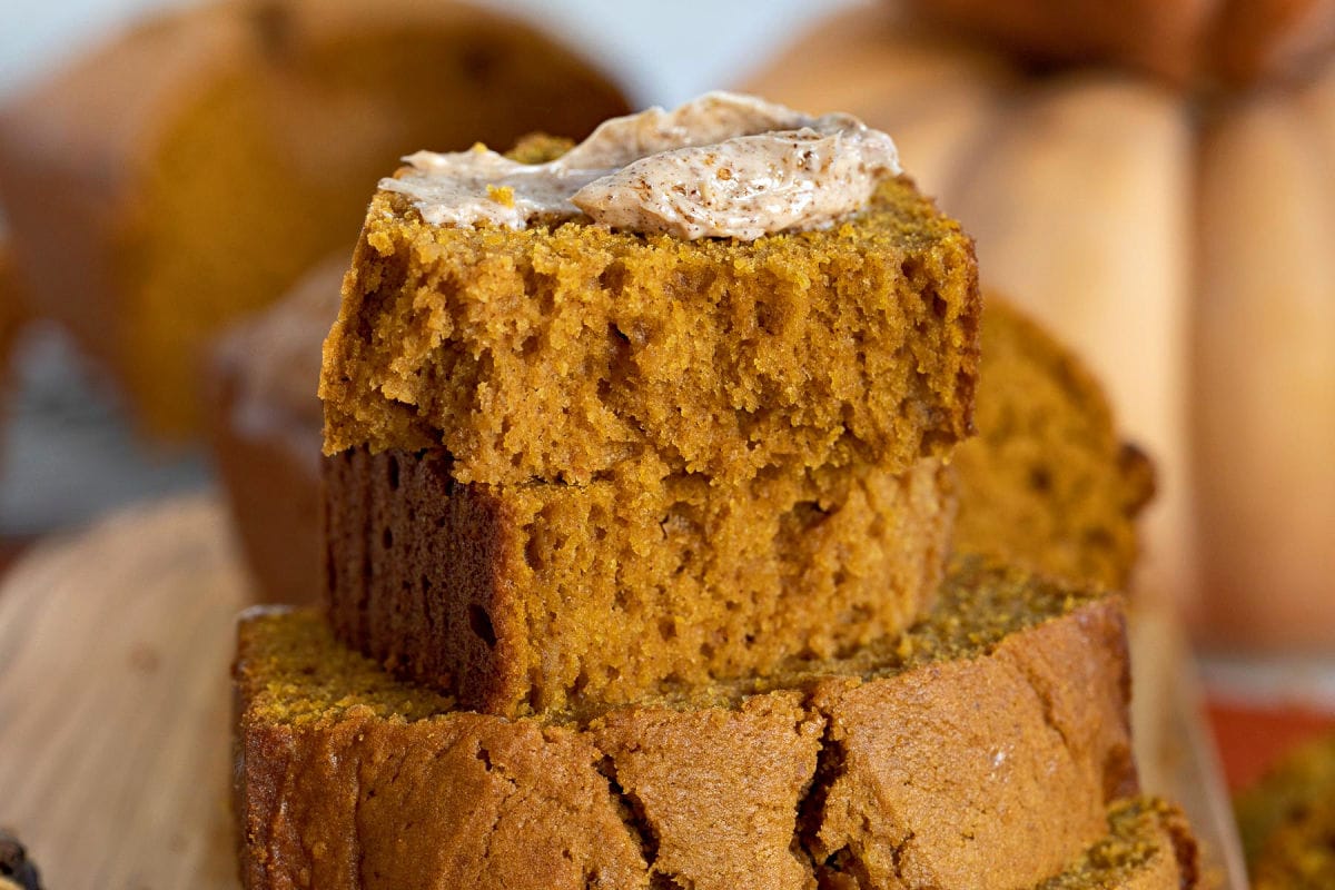 slice of pumpkin bread topped with cinnamon brown sugar butter.