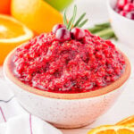 small white clay bowl filled with cranberry orange relish and ready to serve.
