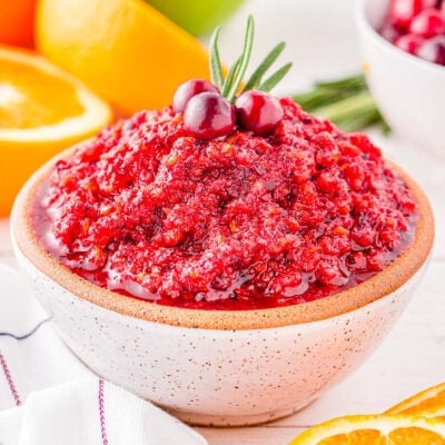 small white clay bowl filled with cranberry orange relish and ready to serve.