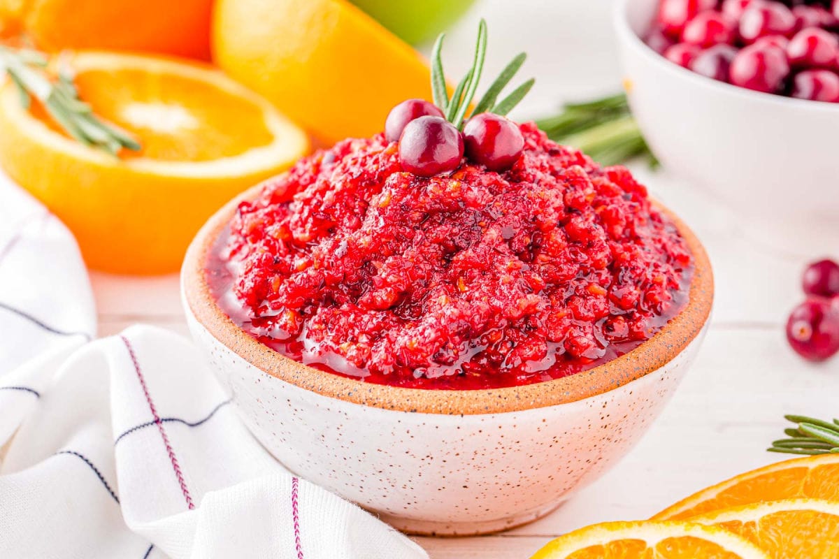 small white clay bowl filled with cranberry orange relish and ready to serve.