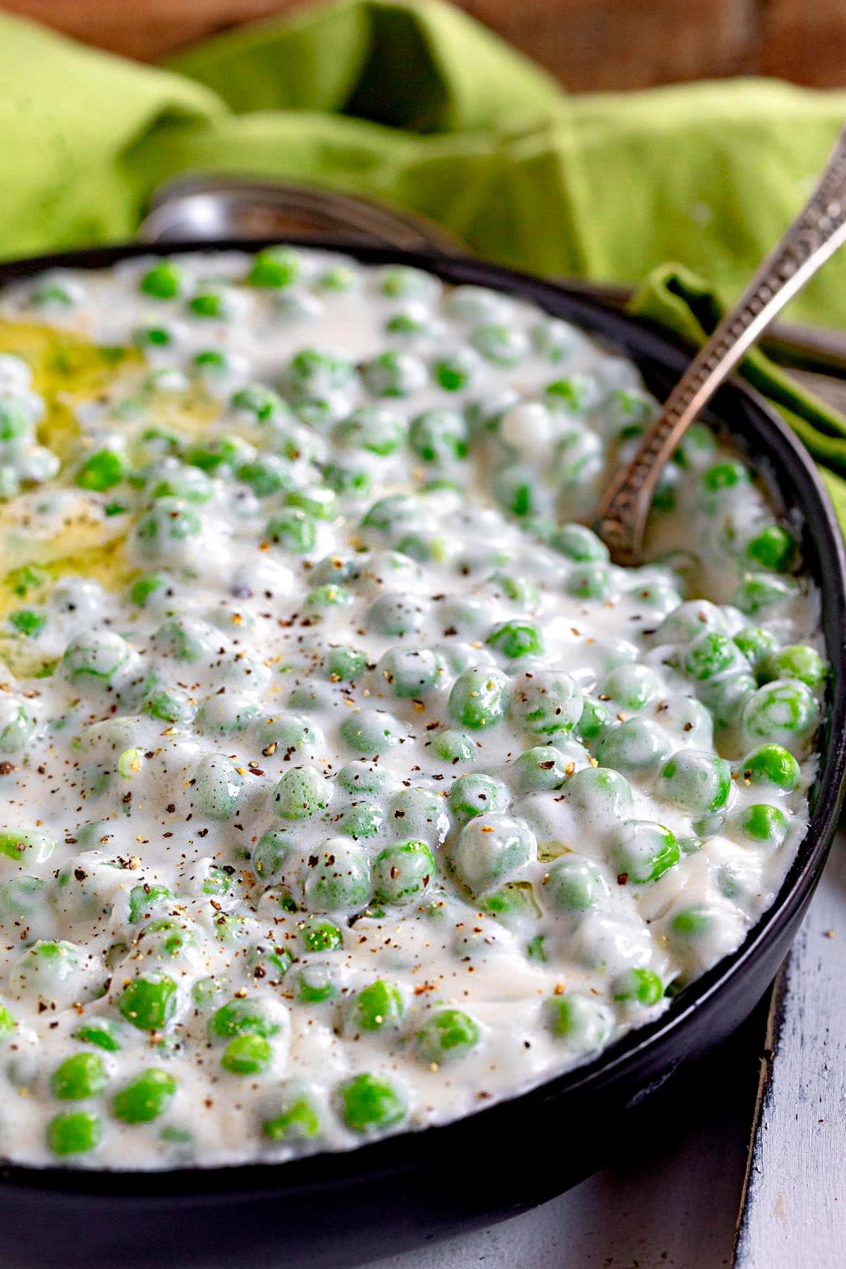 large black bowl filled with creamy peas.