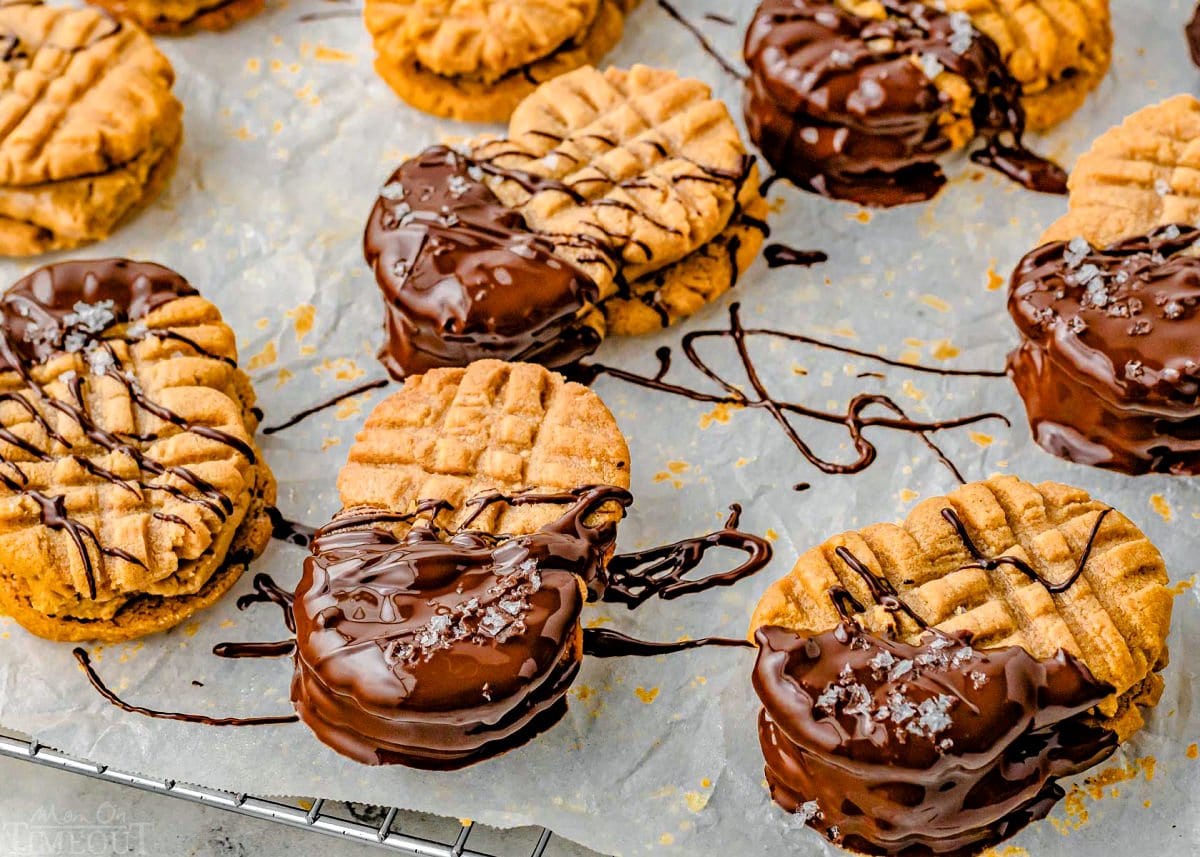 wide shot of peanut butter sandwich cookies dipped in chocolate waiting to be enjoyed.