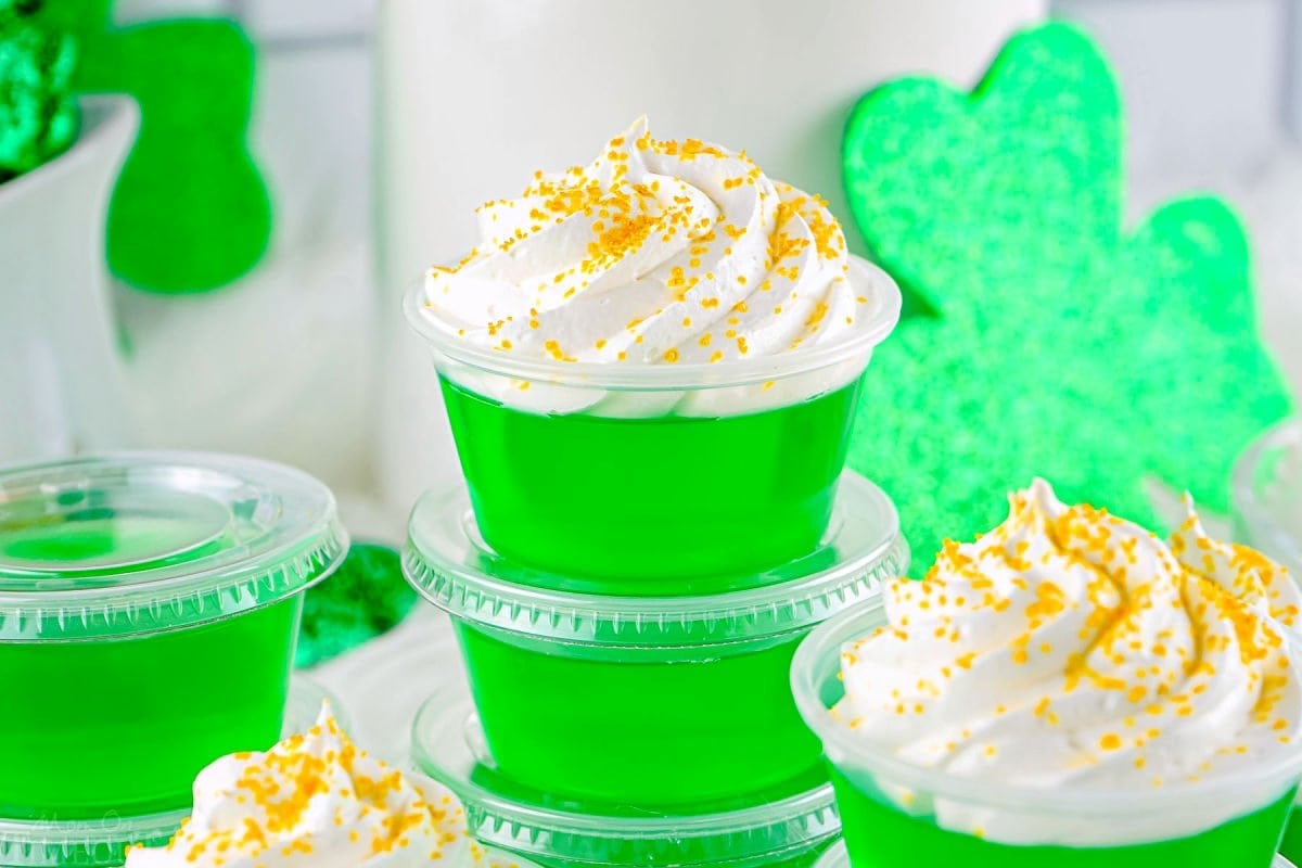 wide shot of jello shots made with lime jello and st patricks day theming.