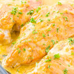 honey mustard chicken breasts baked in a glass baking dish ready to be served all topped with a savory honey mustard sauce.