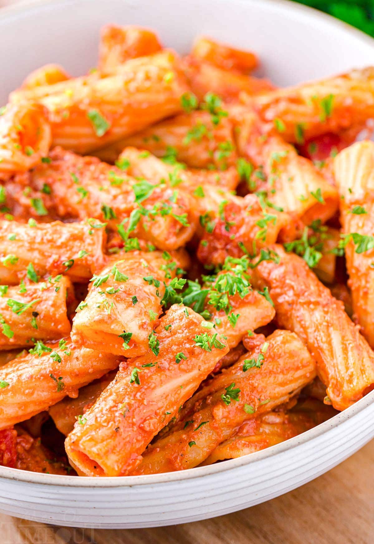 close up look at one pot pasta made with chorizo in large white pasta bowl.