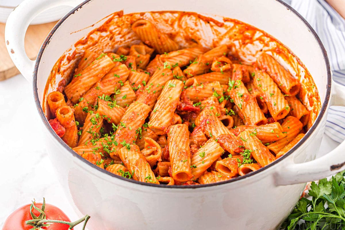 large white dutch oven filled with one pot pasta made with chorizo.