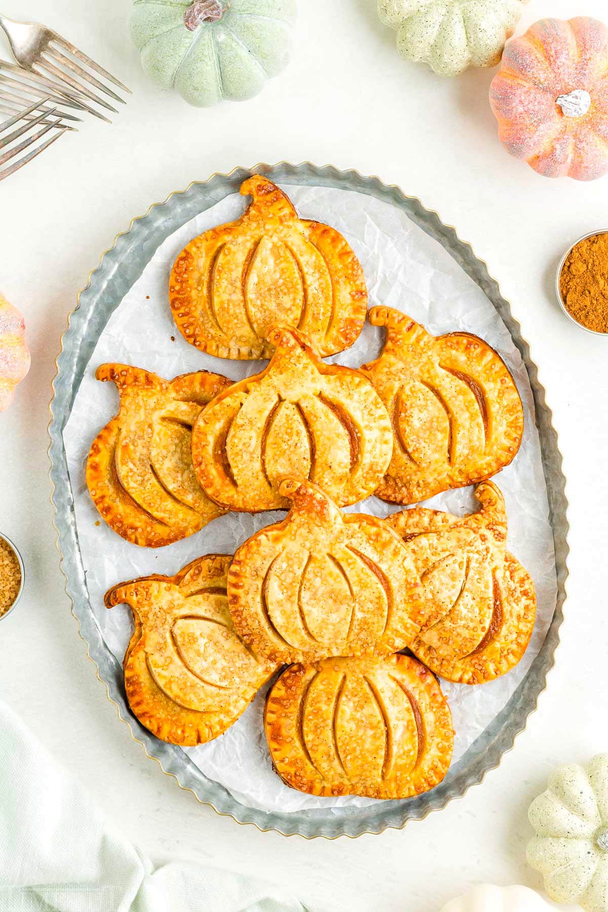 top down view of hand pies on a metal platter all artfully arranged and ready to be enjoyed.