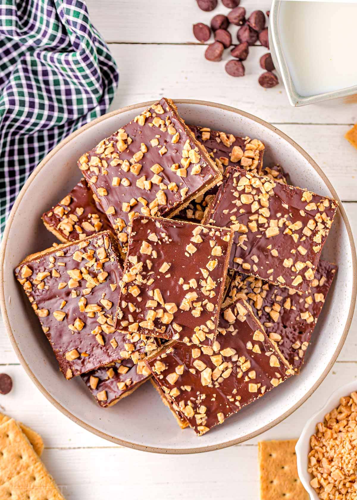 top down look at white round plate piled high with graham cracker toffee.