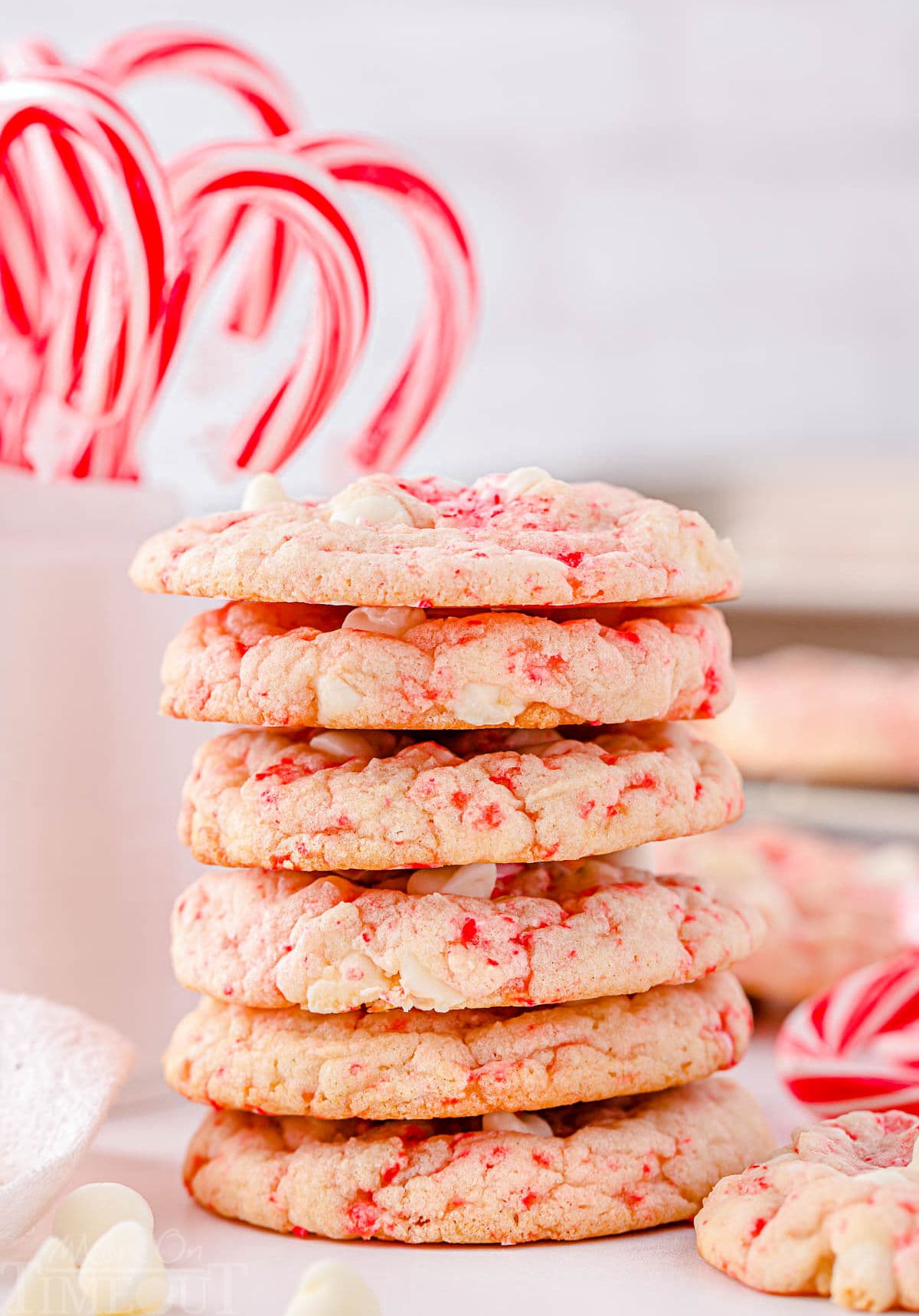 stacked peppermint cookies with lots of white chocolate chips.