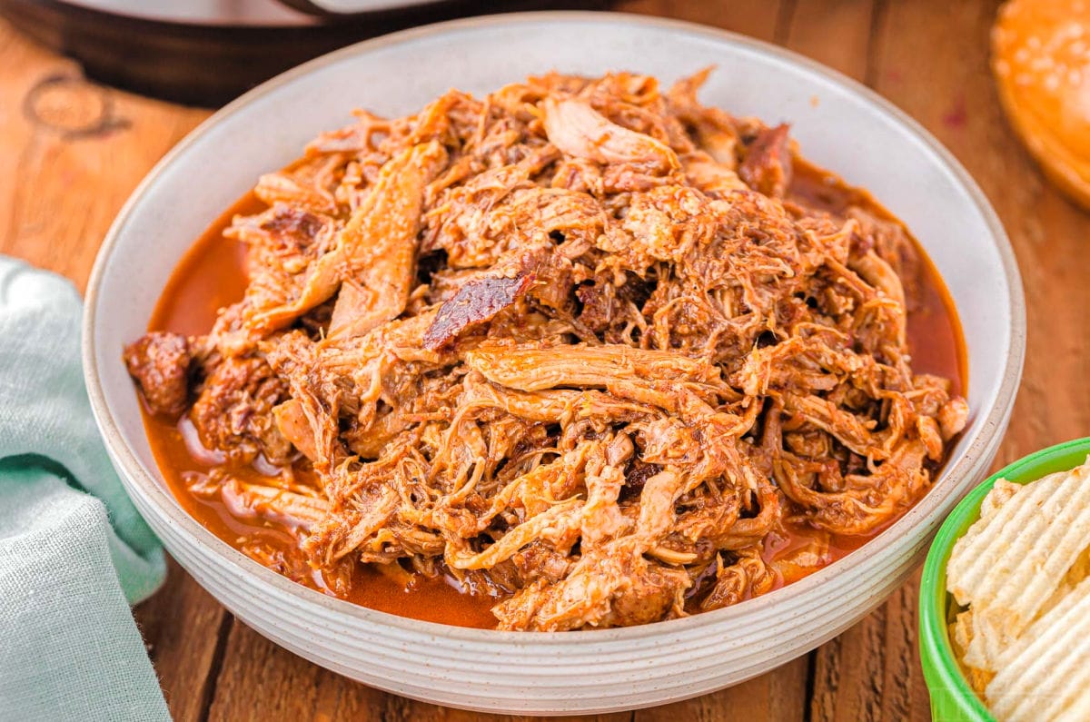 large bowl filled with shredded pulled pork.