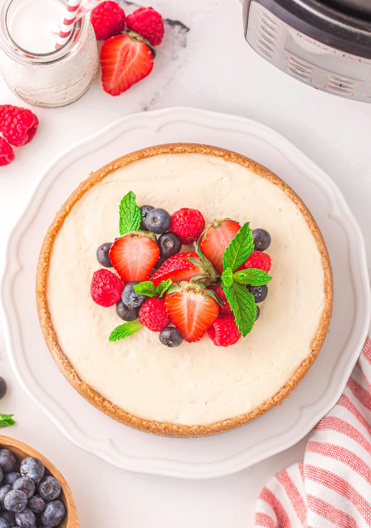 top down view of whole cheesecake topped with fresh berries.