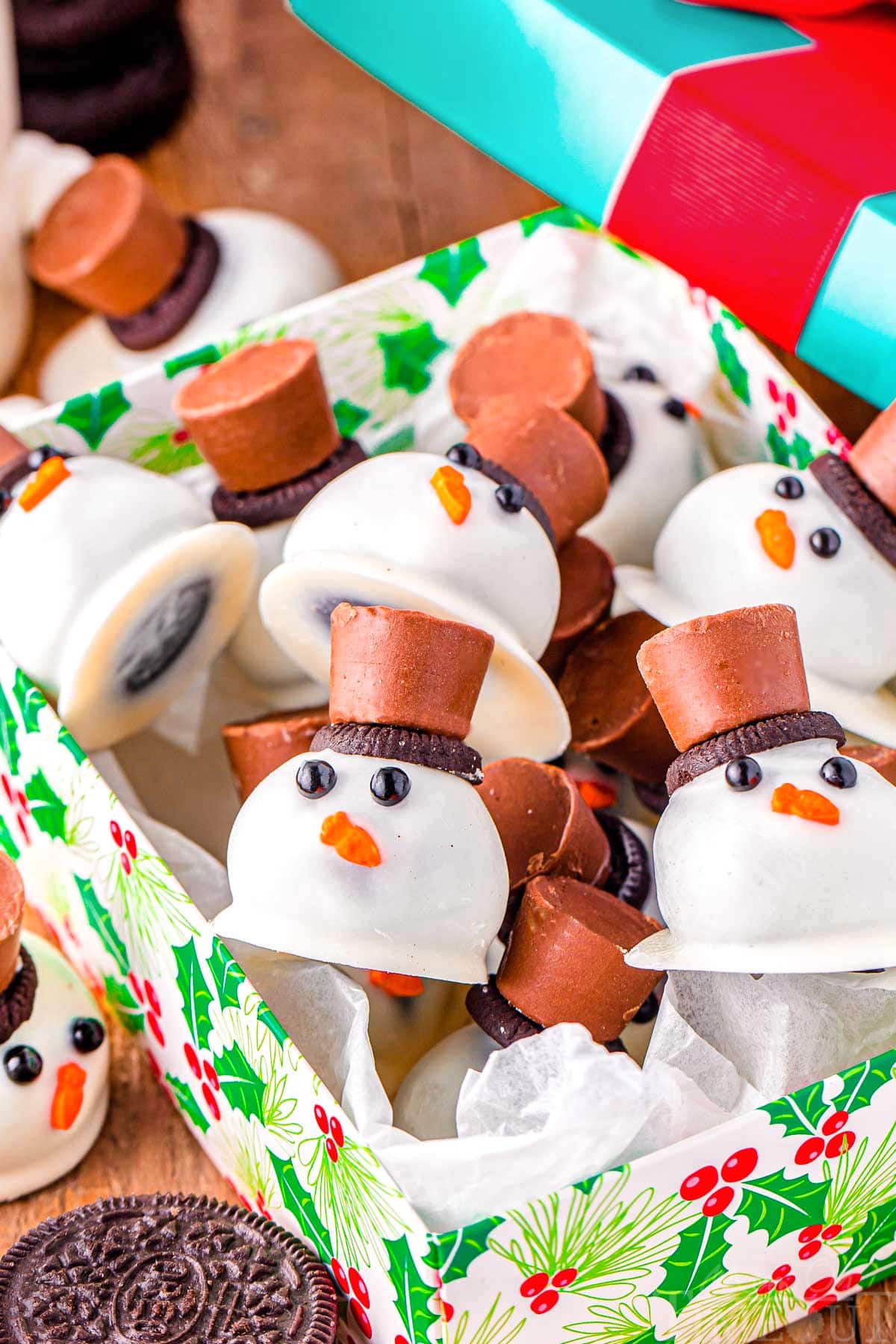 snowman oreo balls in a christmas box ready to be enjoyed.
