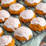 iced pumpkin oatmeal cookies on wire rack.