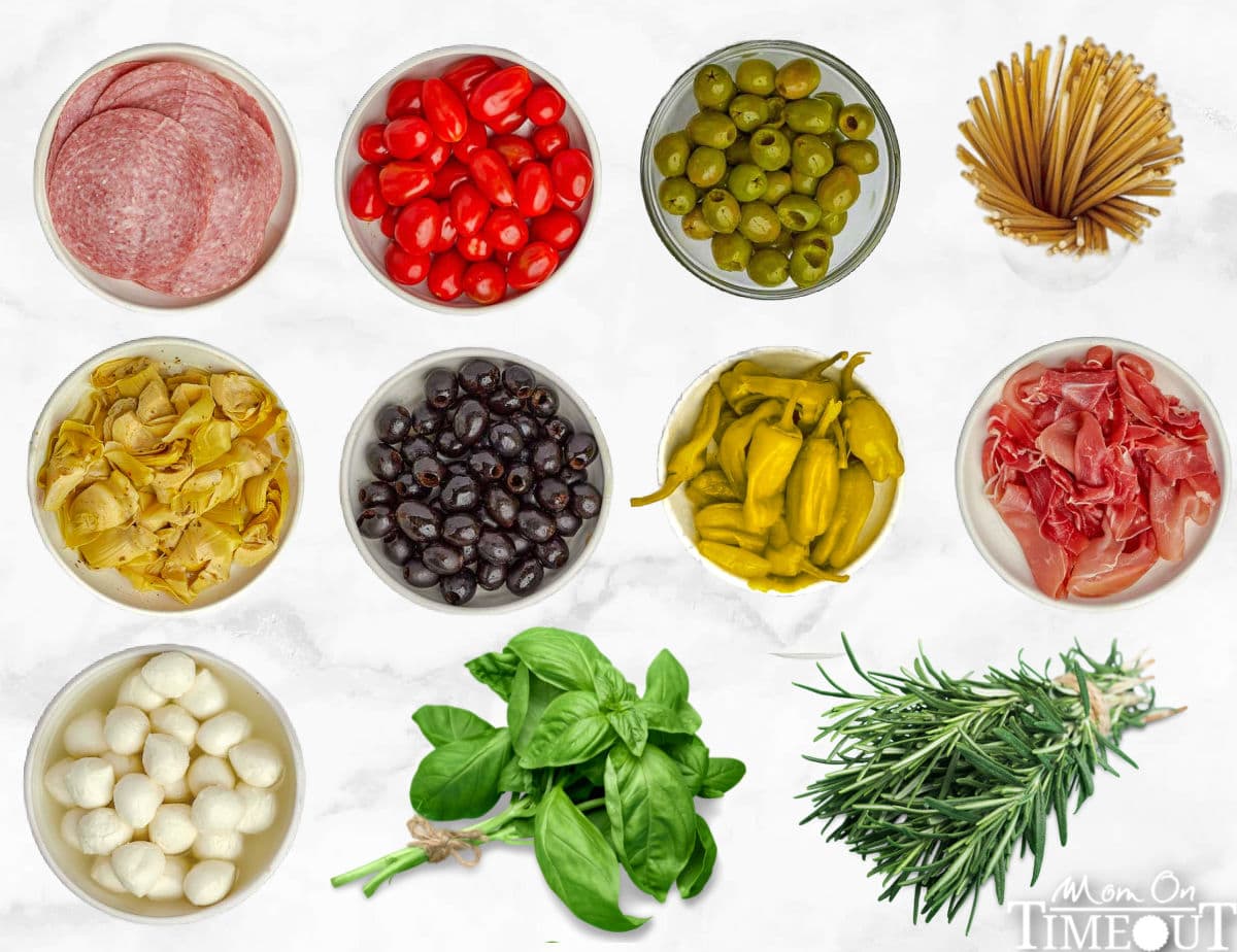 all the ingredients for a charcuterie wreath laid out in small bowls ready to assemble.