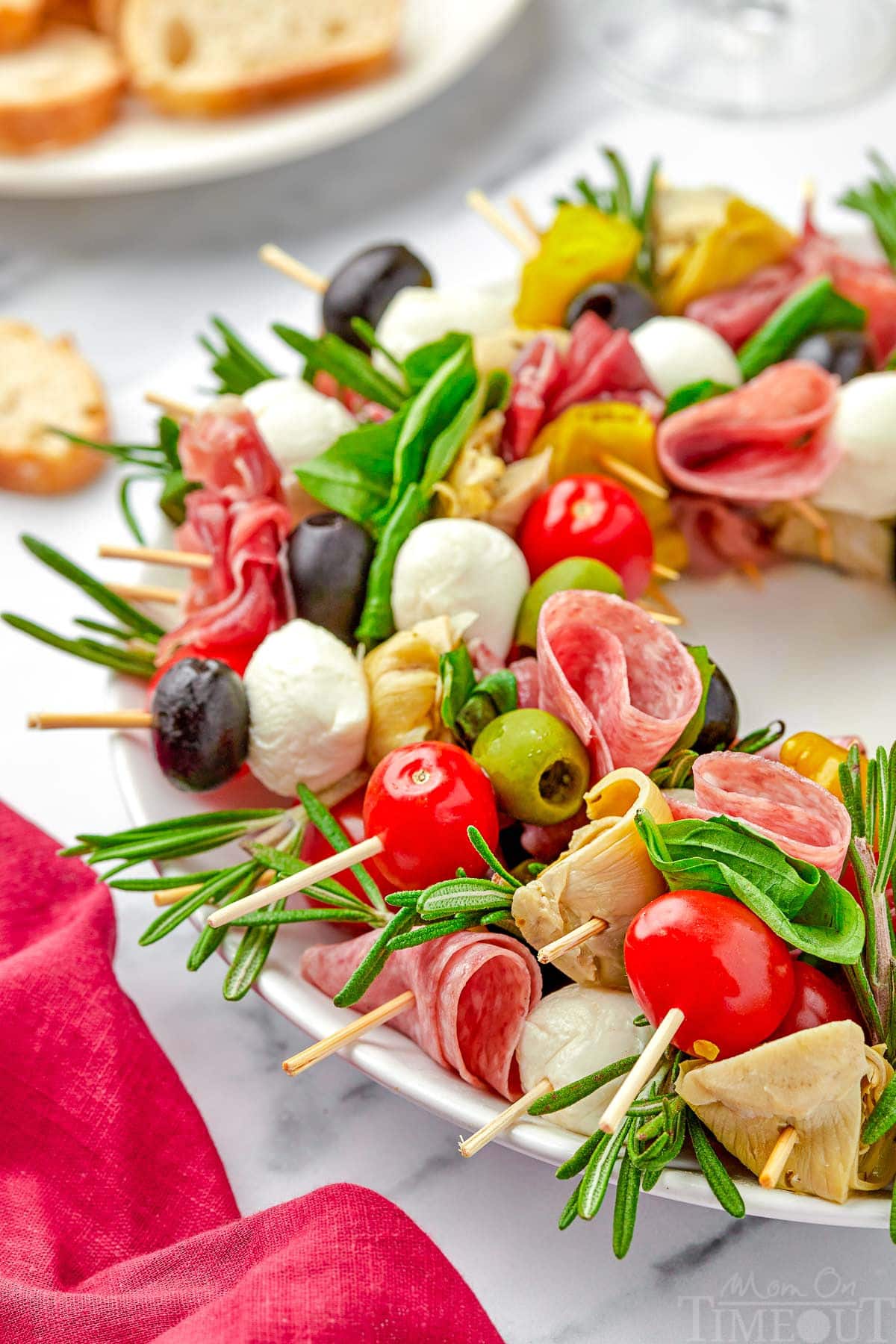 close up look at antipasto wreath made with skewers of classic antipasto ingredients.
