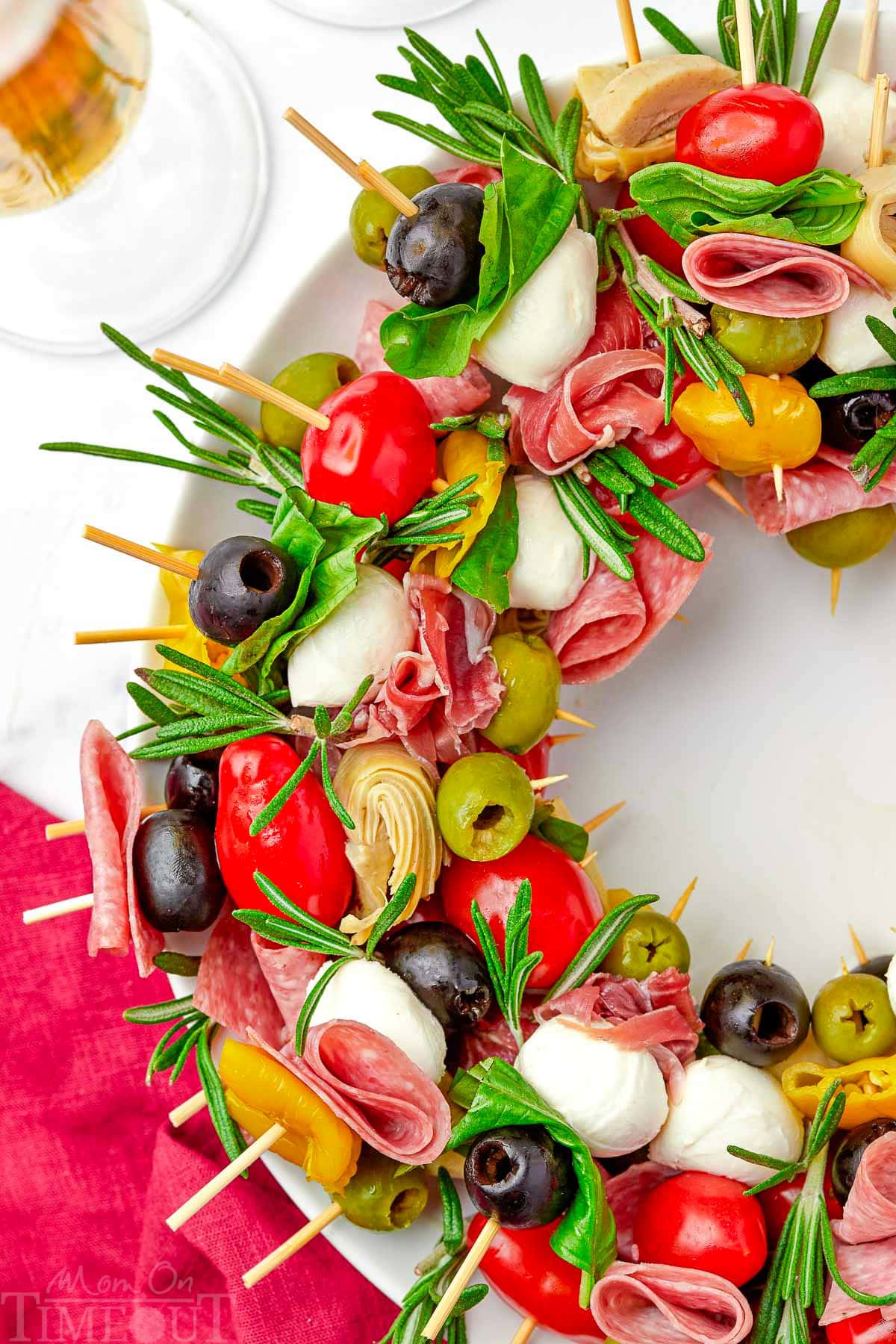 close up look at antipasto wreath made with skewers of classic antipasto ingredients.