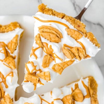 piece of fluffernutter pie being lifted out of the white pie dish.