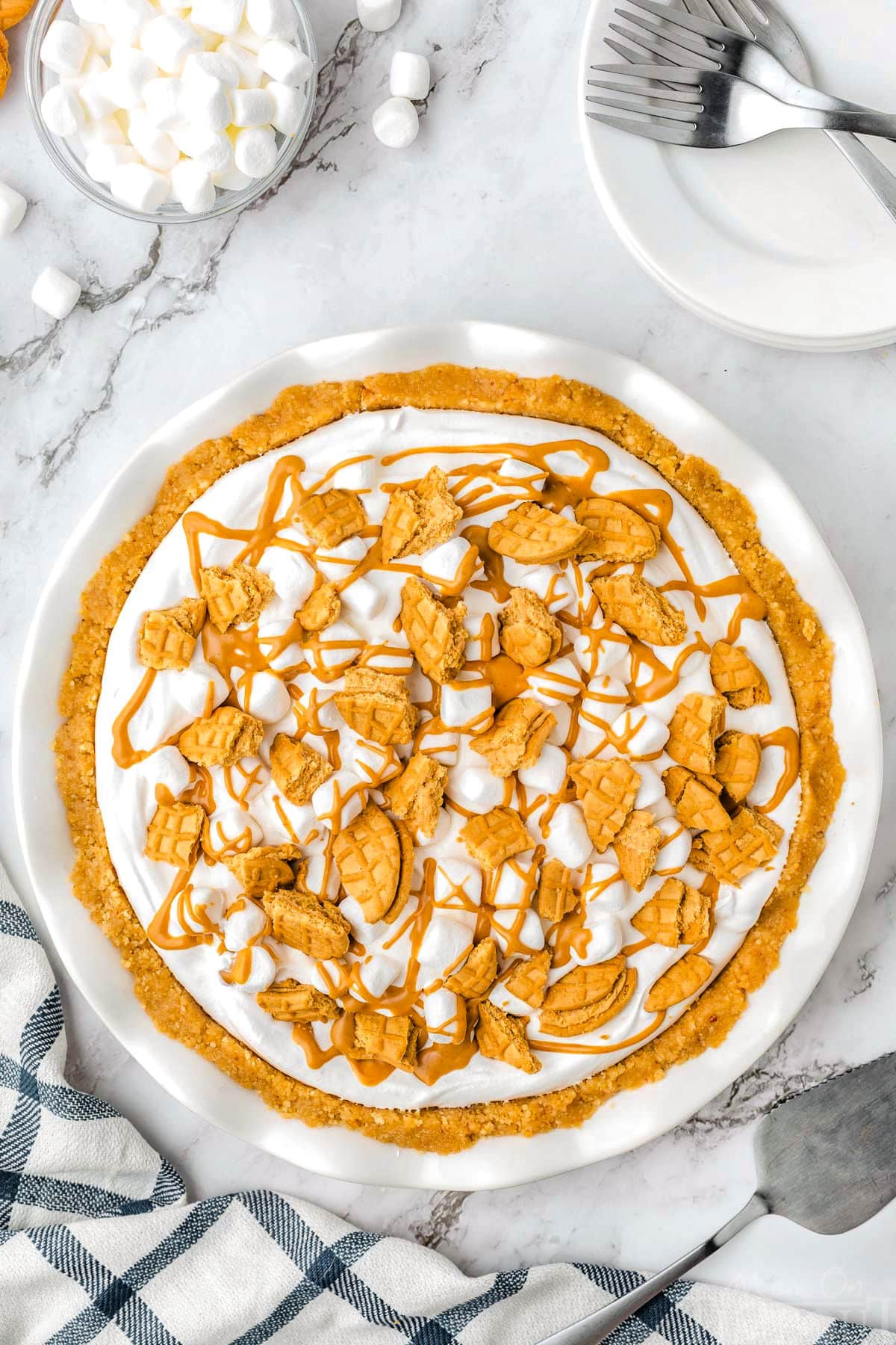 Top down view of a whole Fluffernutter Pie in a white pie dish.