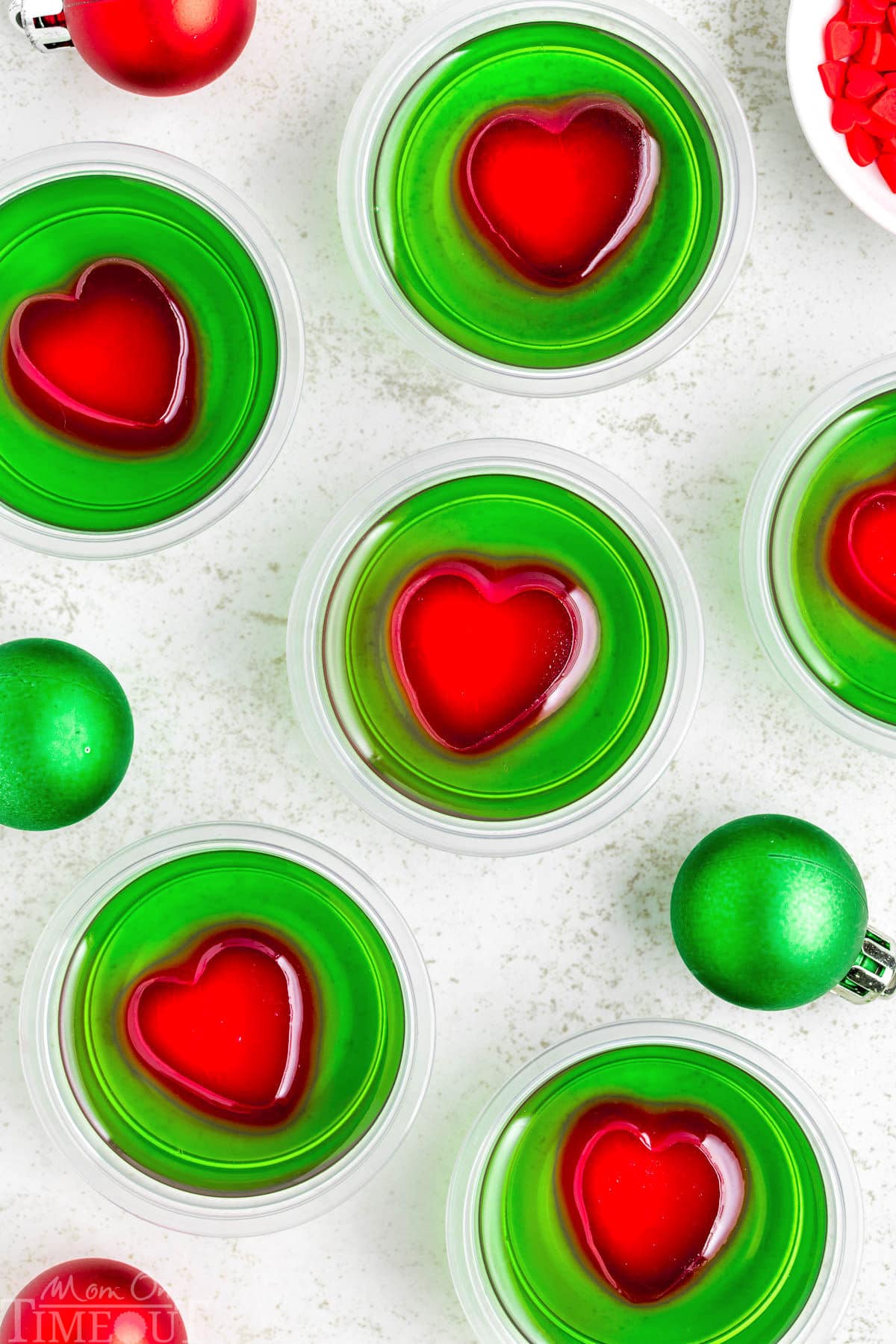 A top down view of a bunch of grinch shots on a white surface.
