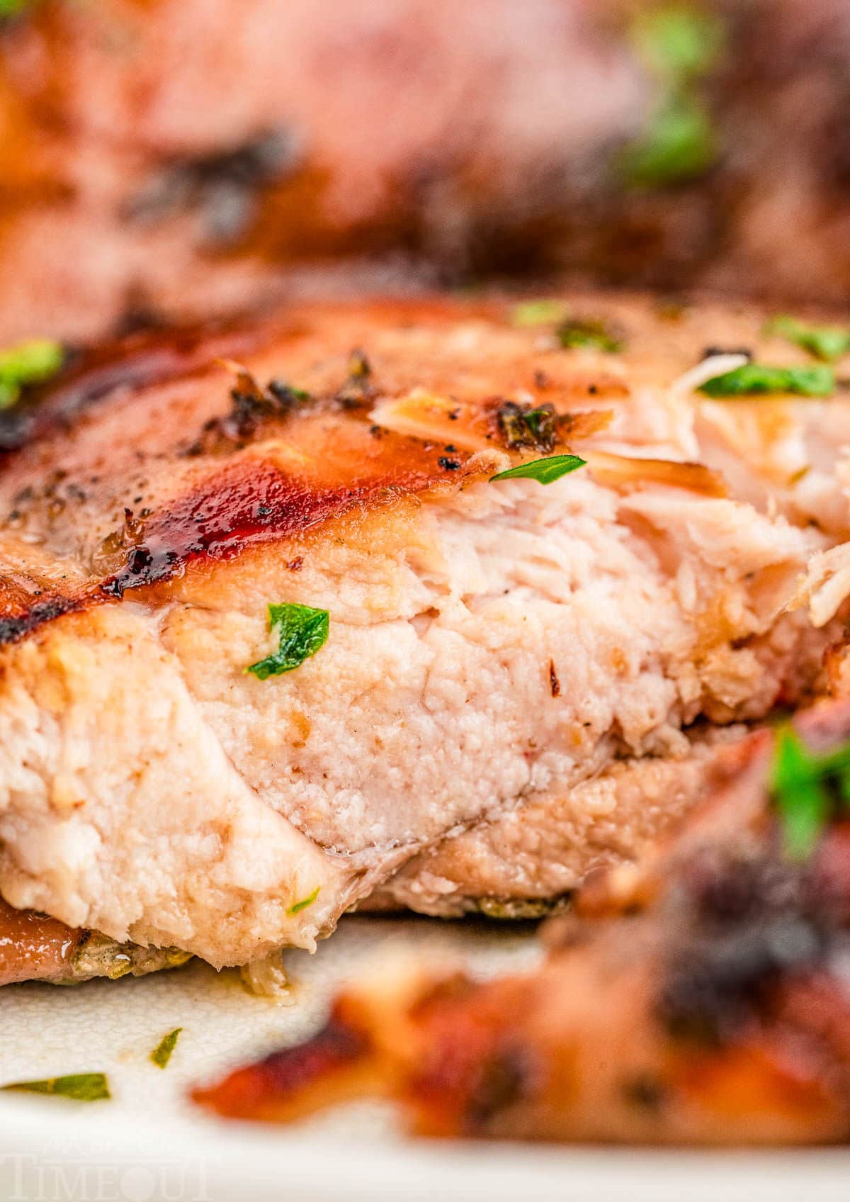Profile shot of balsamic chicken recipe cut in half.