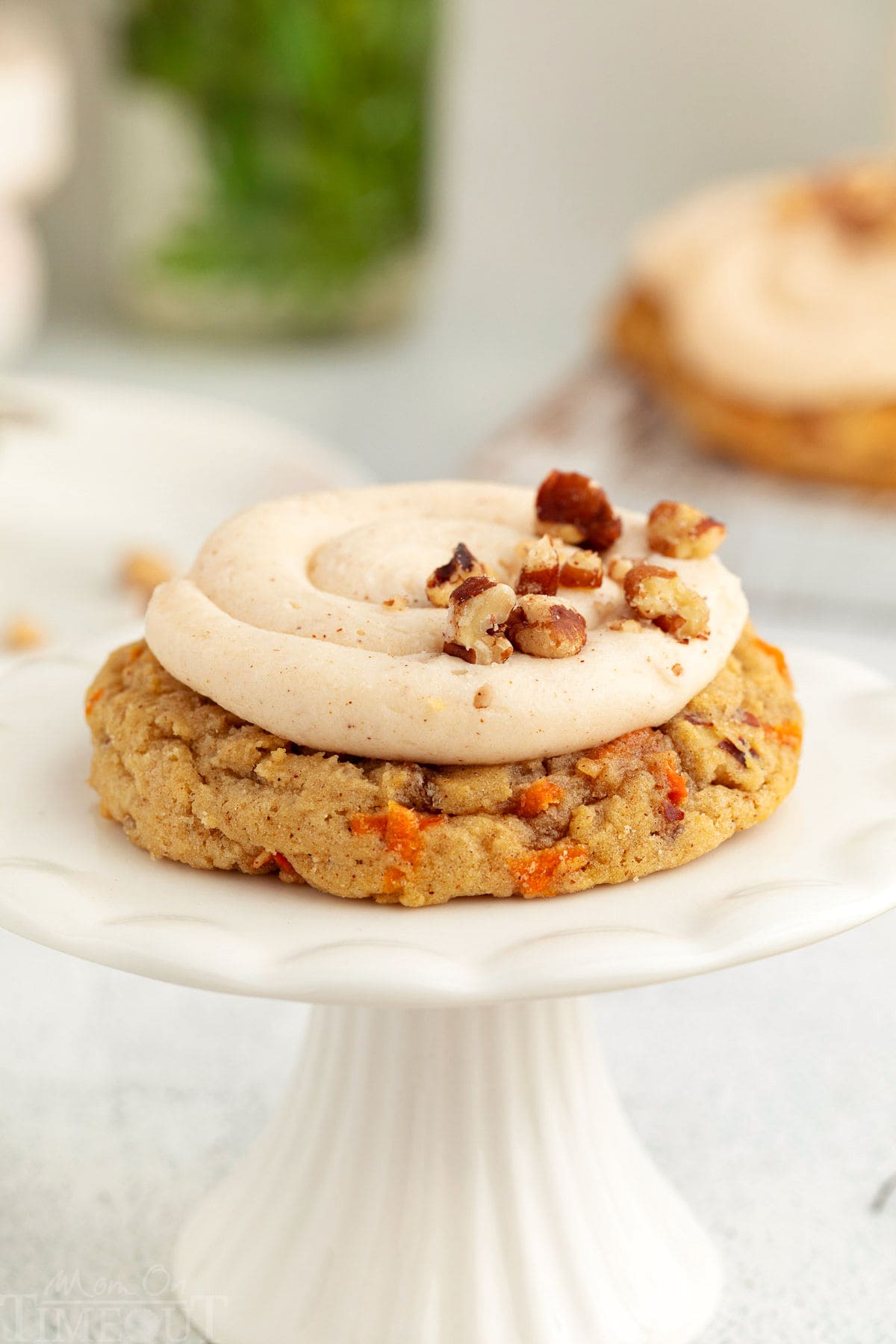 Carrot Cake Cookie on a white cookie stand.