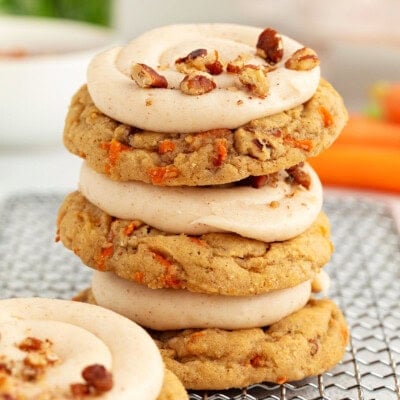 Carrot Cake Cookies stacked up on a cooling rack.