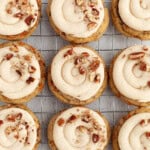 Carrot Cake Cookies lined up on a cooling rack.