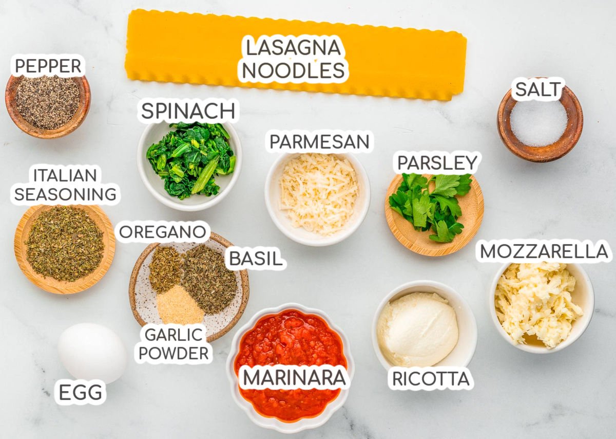 Top down shot of ingredients for lasagna roll up recipe. Ingredients are all labeled.