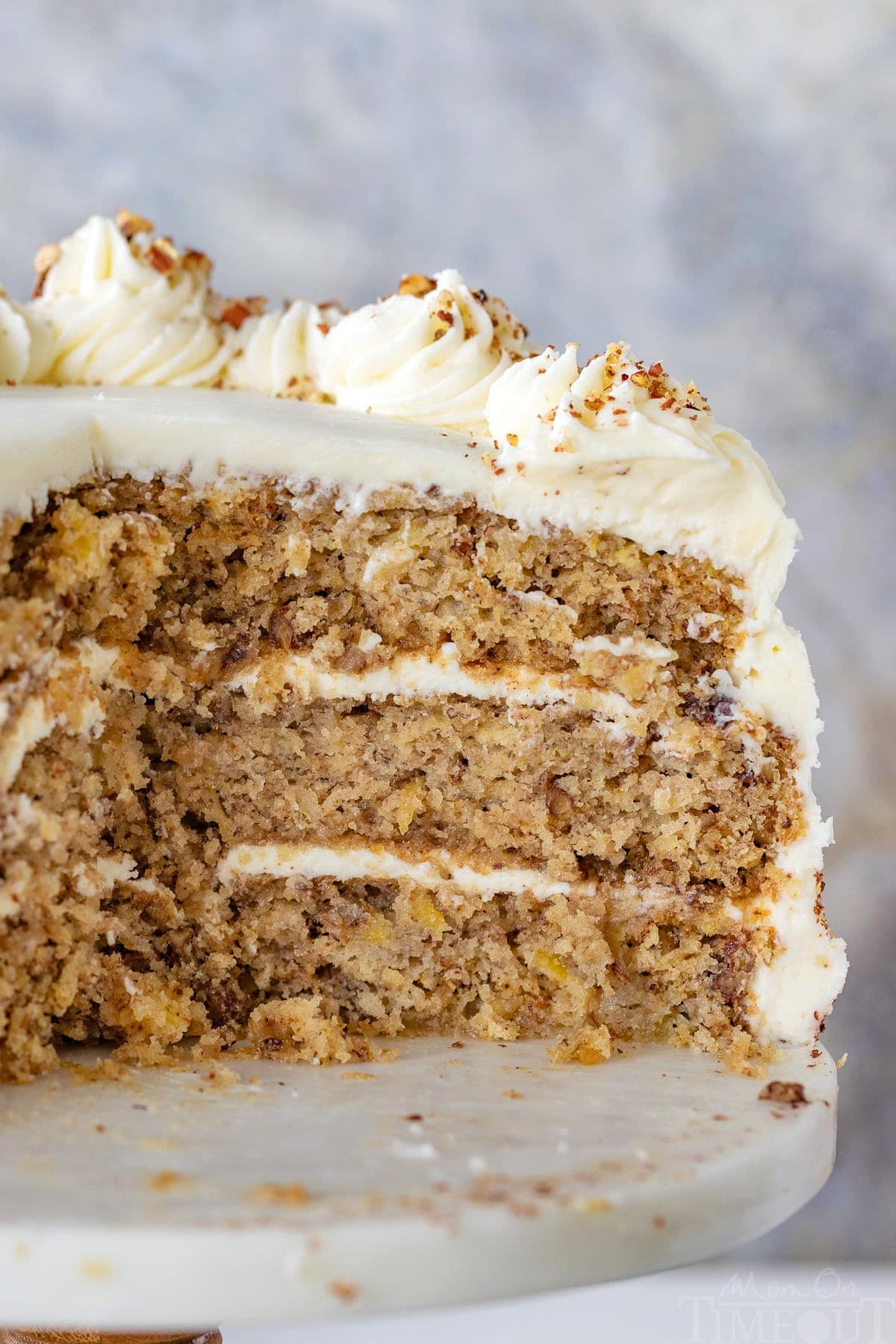 Cross section recipe for the hummingbird cake on white cake stand.