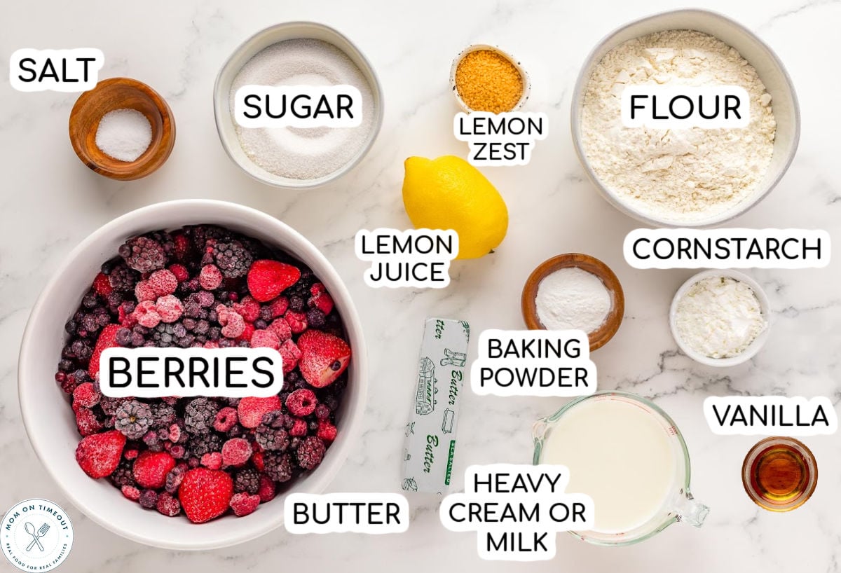 Berry cobbler ingredients measured out into small bowls and ready to be used in the recipe.