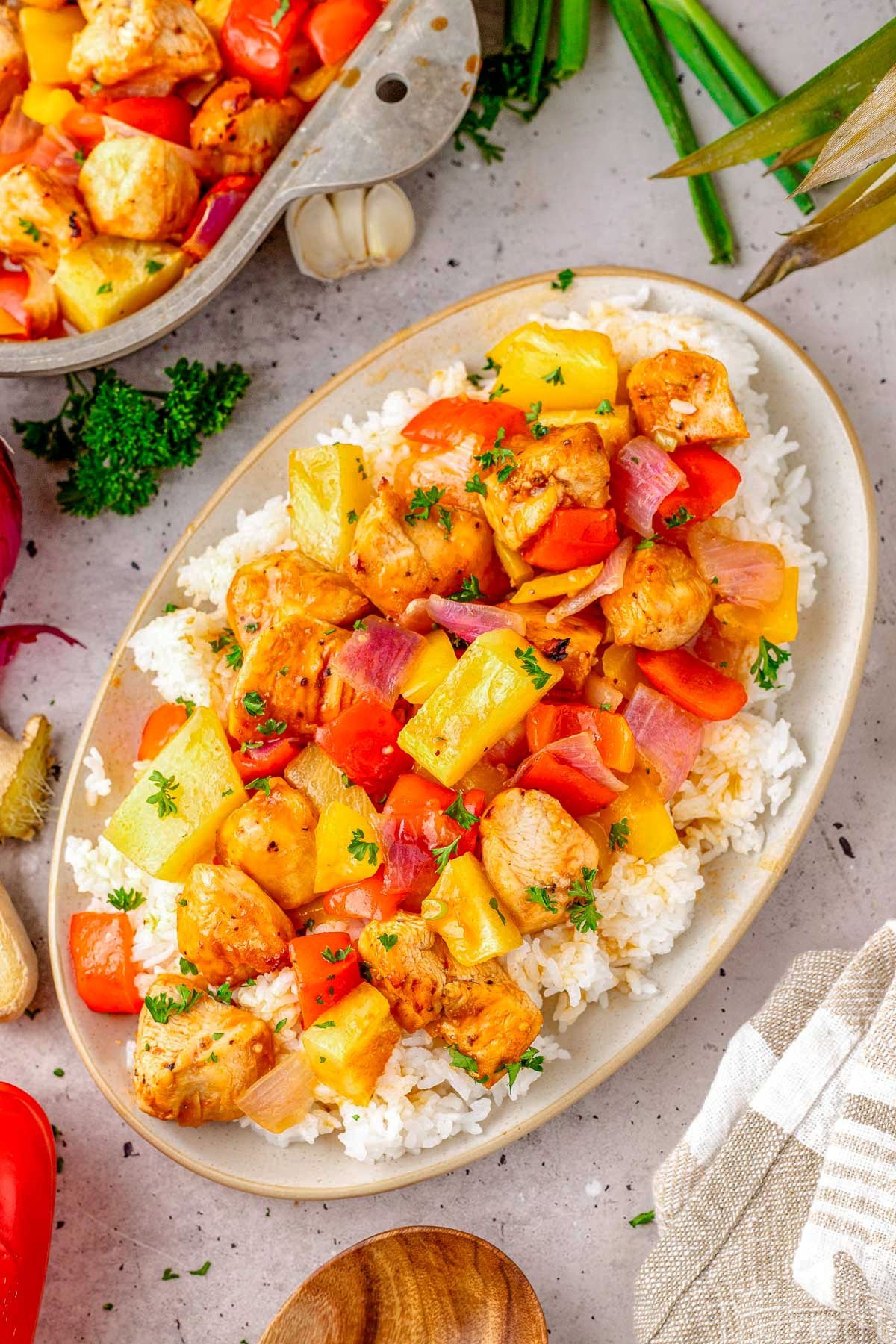 Hawaiian Chicken recipe plated with rice on an oval plate.