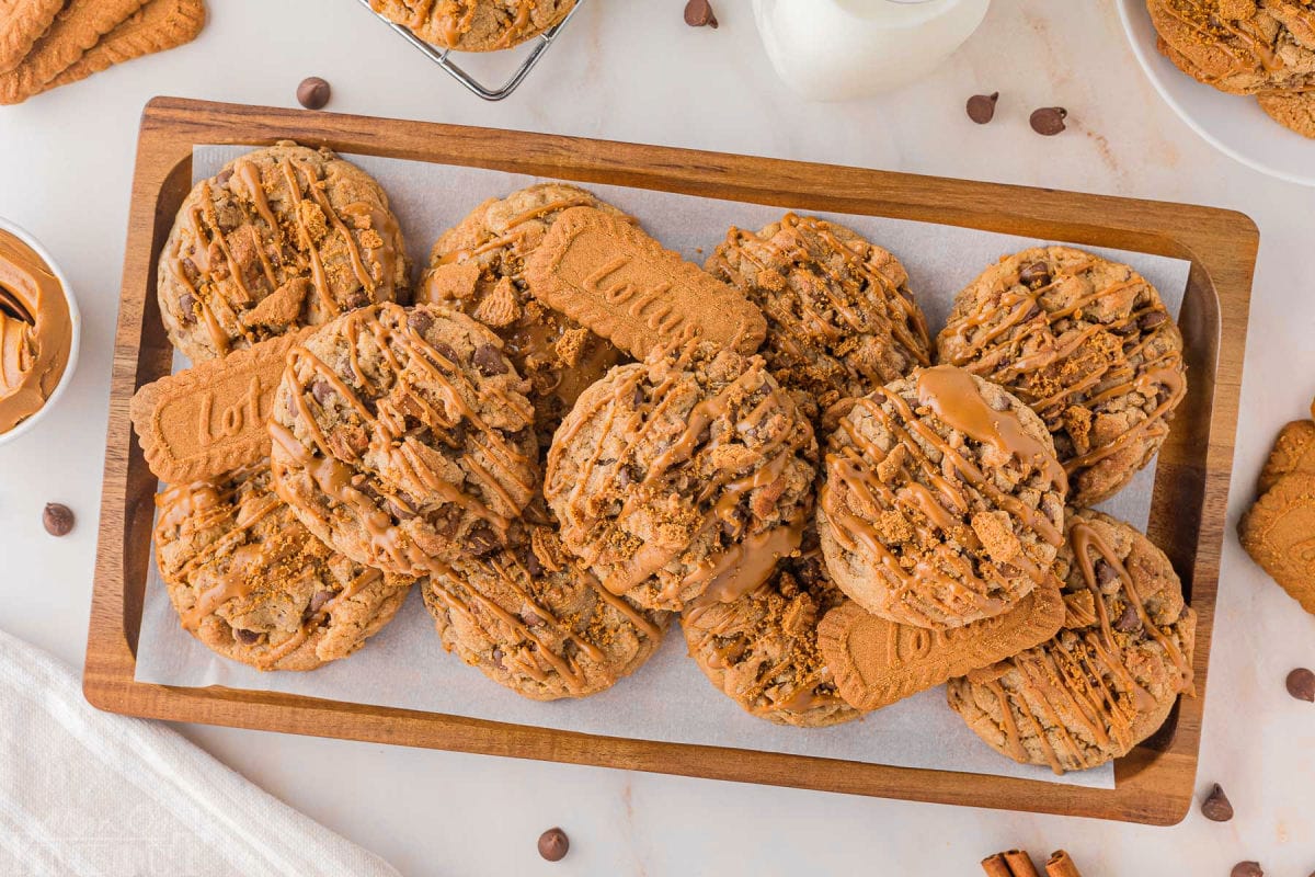 Wood tray filled with biscoff cookie butter cookies and biscoff cookies.
