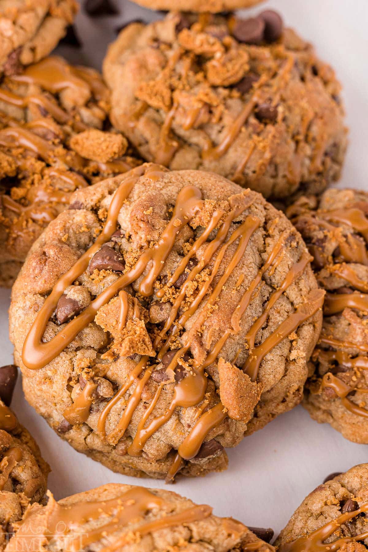 Biscoff cookies recipe shown with about five cookies drizzled with cookie butter on top.
