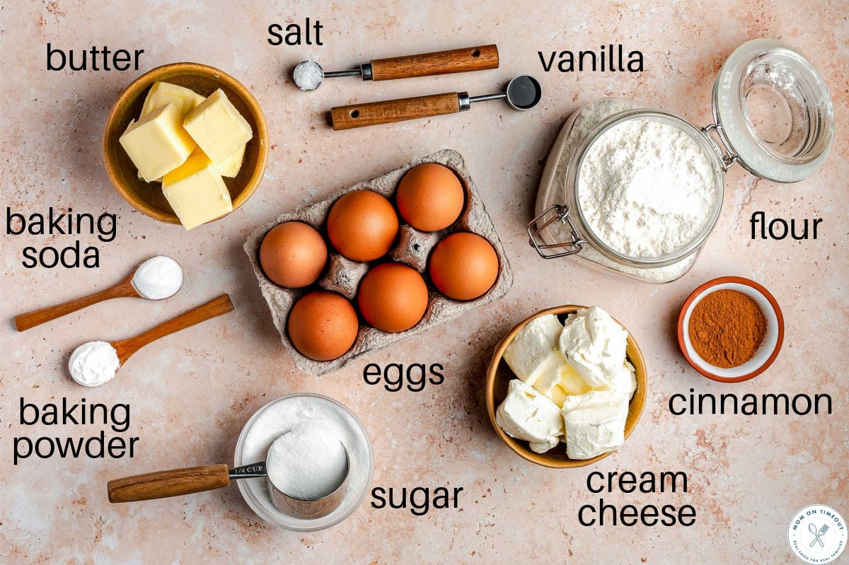 Overhead shot of churro cheesecake cookies ingredients measure out into small bowls ready to be used in the recipe.