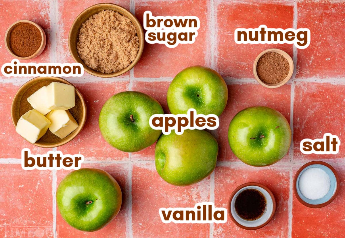 Overhead shot of all the ingredients for fried apples recipe laid out and ready to be used in the recipe. Each ingredient is labeled.
