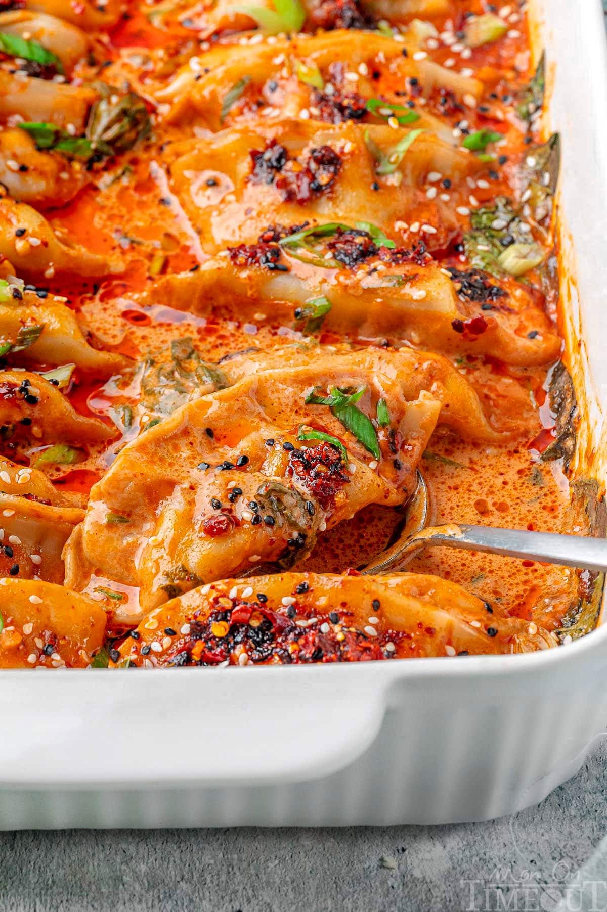 White baking dish with viral baked dumplings ready to be served.