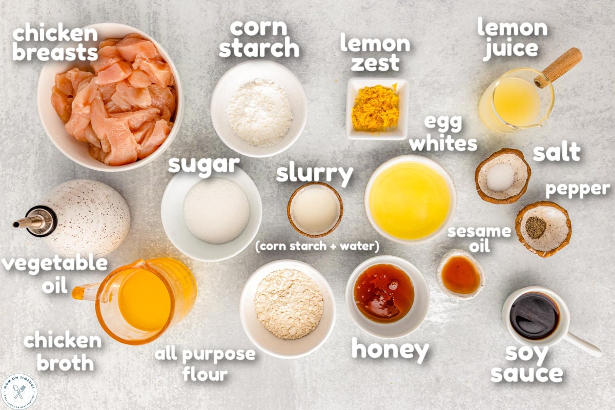 Overhead shot of chinese lemon chicken ingredients measured out into small bowls ready to be used in the recipe. Ingredients have a text overlay.