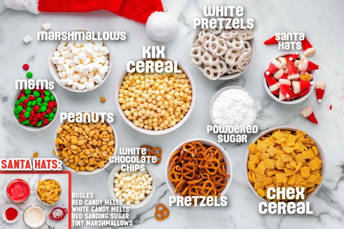 Overhead shot of ingredients used in santa's snack mix. Text labels are shown for each ingredient measured out into small bowls.