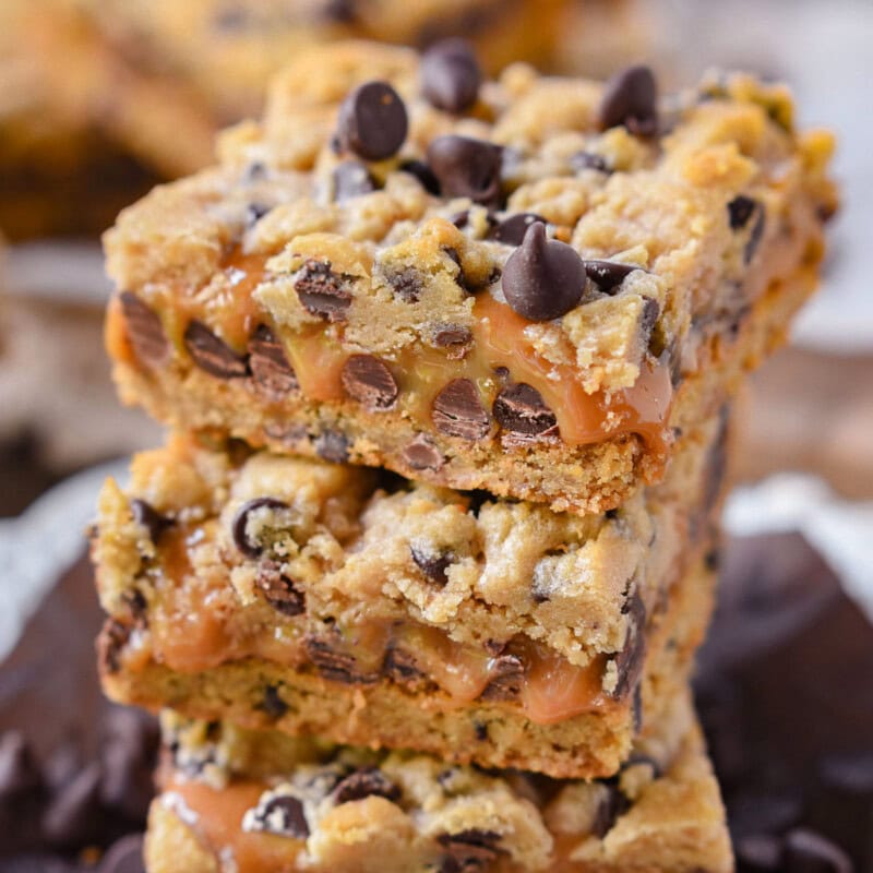 Carmelitas recipe graphic showing a stack of carmelitas bars with ooey gooey caramel. Text overlay at top and bottom of image.