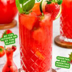 Strawberry Mojito in glass garnished with mint and strawberries. Small image of pitcher of strawberry mojitos in bottom left corner. Text overlay at top and bottom of image.