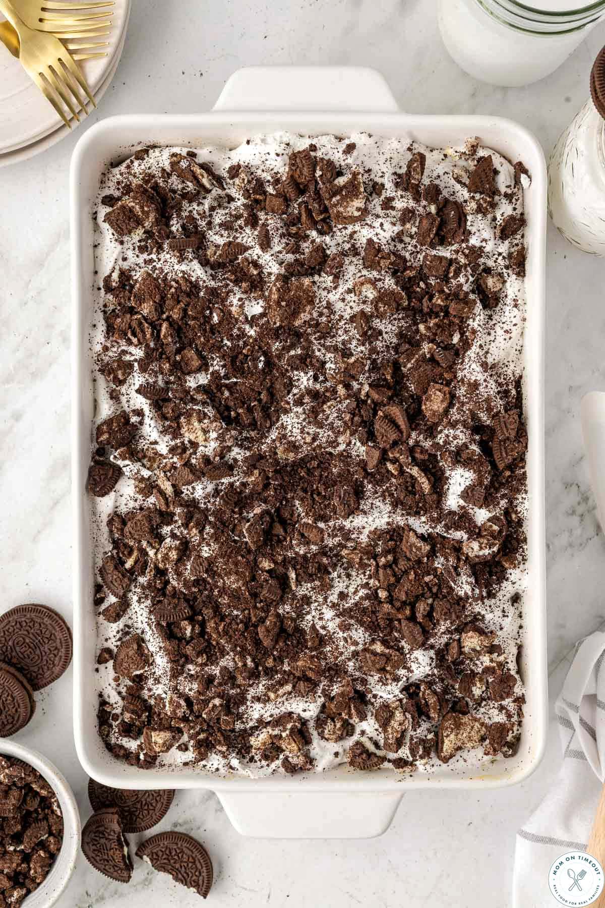 Top down view of the oreo poke cake in 9 x 13 white baking dish.