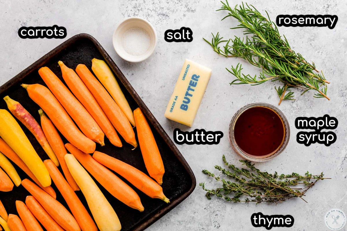 Overhead shot of ingredients for maple roasted carrots with text labels.